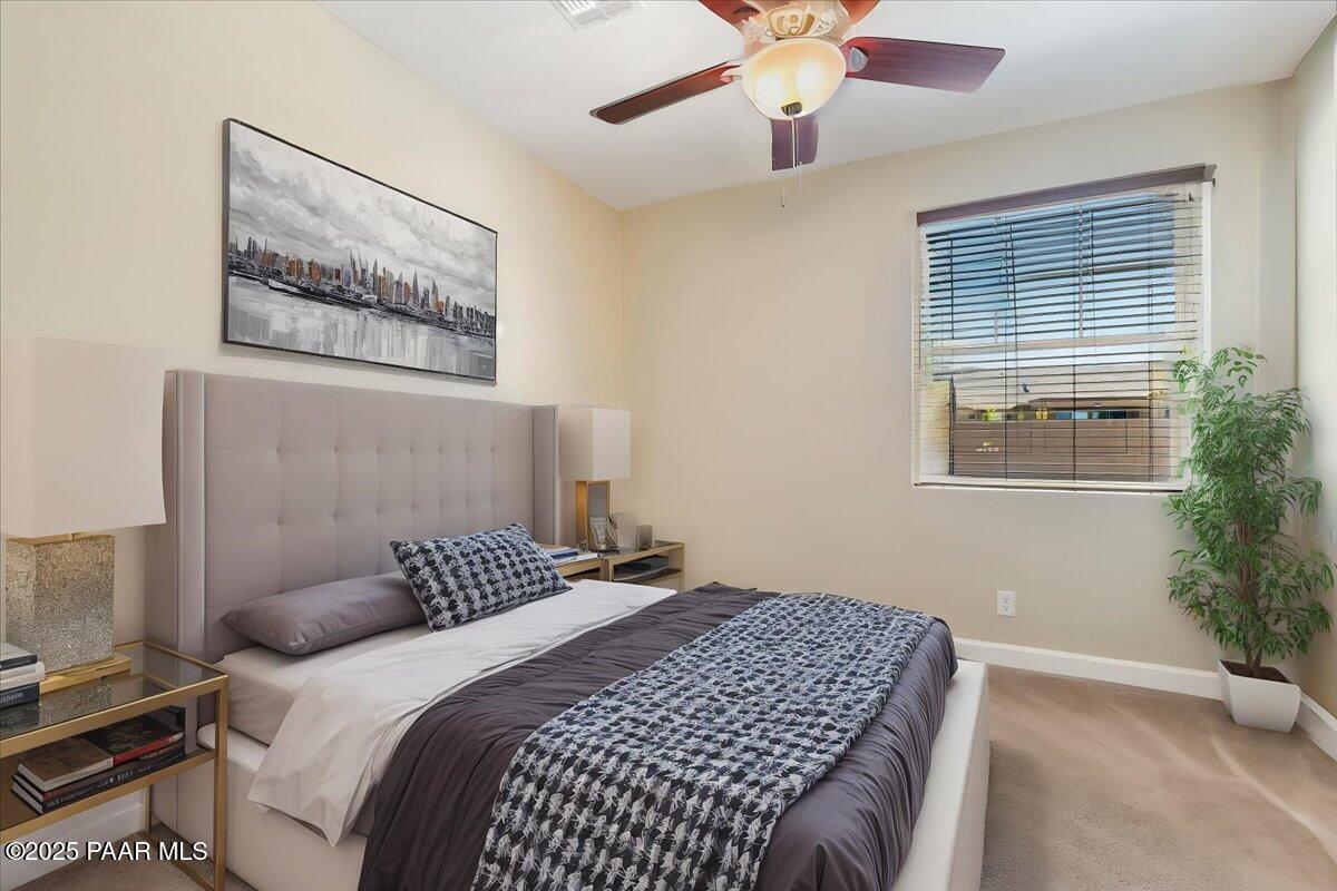 1149 Stack Rock Road Prescott Valley, AZ 86314 - Photo 27 of 85 a bedroom with a bed and a window