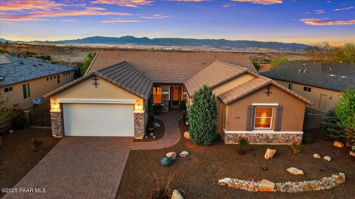 1149 Stack Rock Road Prescott Valley, AZ 86314 - Photo 3 of 85 a front view of a house with a yard and lake view