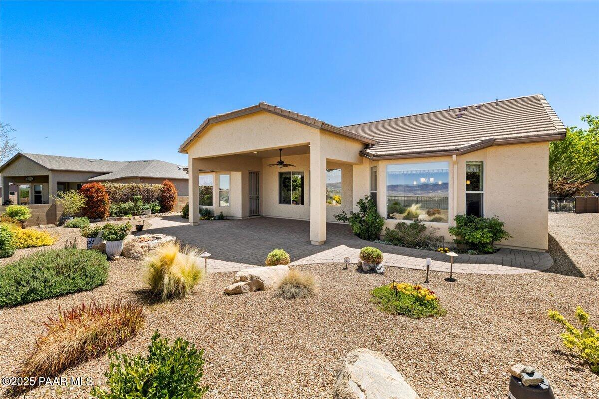 1149 Stack Rock Road Prescott Valley, AZ 86314 - Photo 42 of 85 a front view of a house with garden