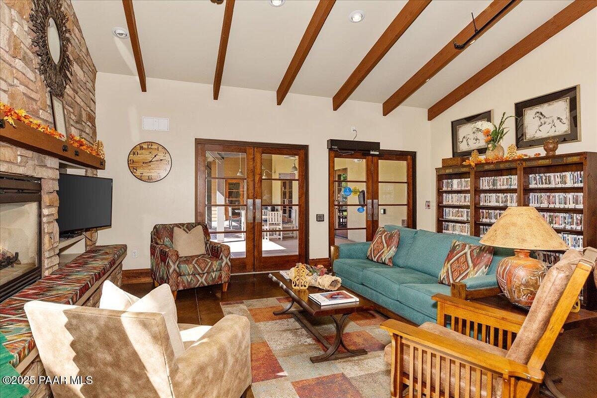 1149 Stack Rock Road Prescott Valley, AZ 86314 - Photo 72 of 85 a living room with furniture a rug and a floor to ceiling window