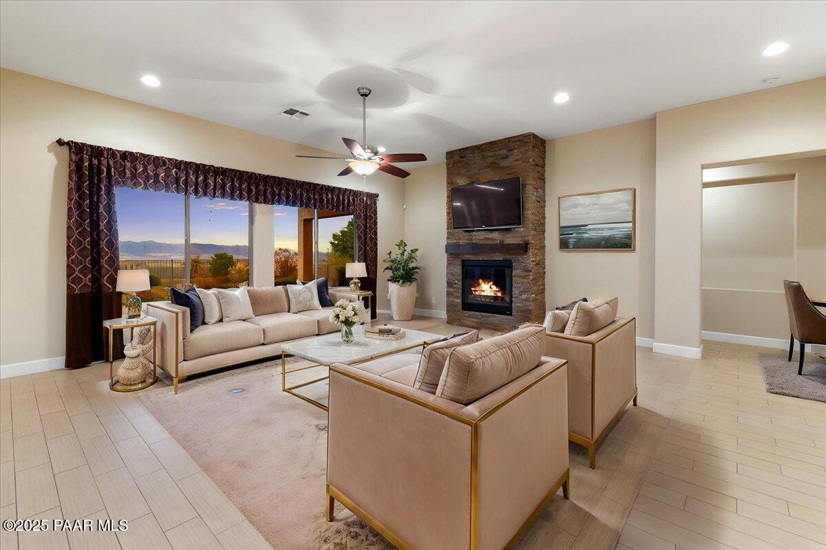 1149 Stack Rock Road Prescott Valley, AZ 86314 - Photo 8 of 85 a living room with fireplace furniture and a large window