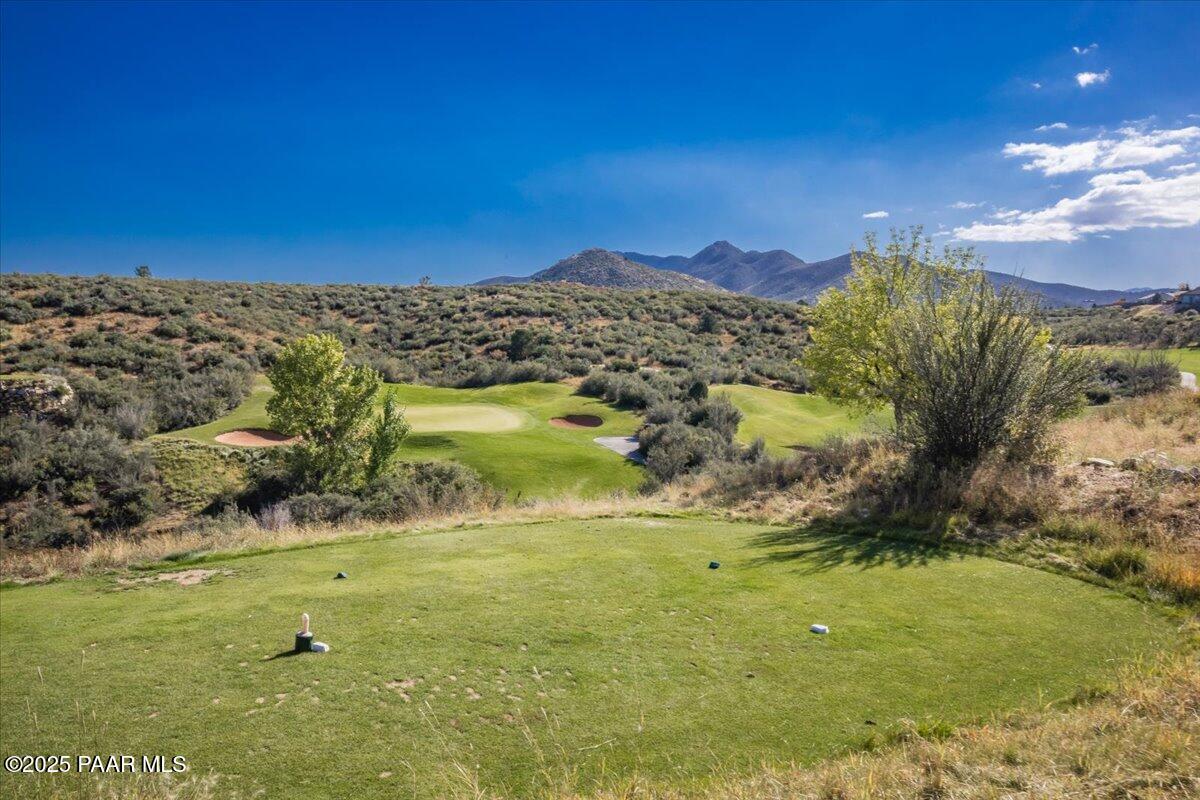 1149 Stack Rock Road Prescott Valley, AZ 86314 - Photo 83 of 85 a view of a lake with a mountain in the background