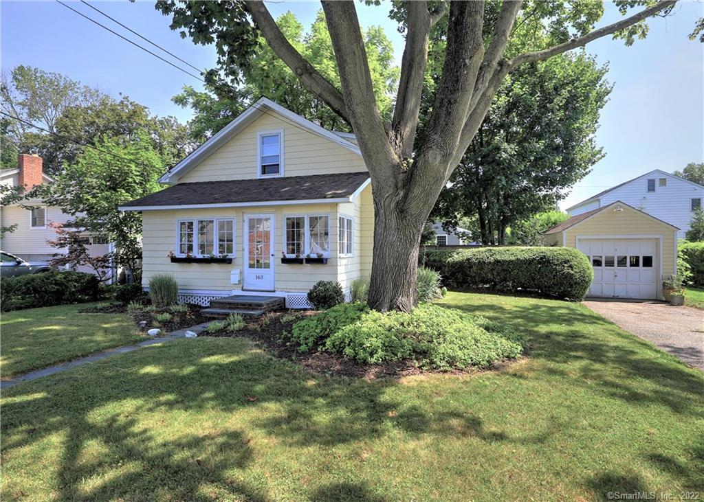 163 Alden Street Fairfield, CT 06824 - Photo 1 of 1 a front view of house with a garden and patio