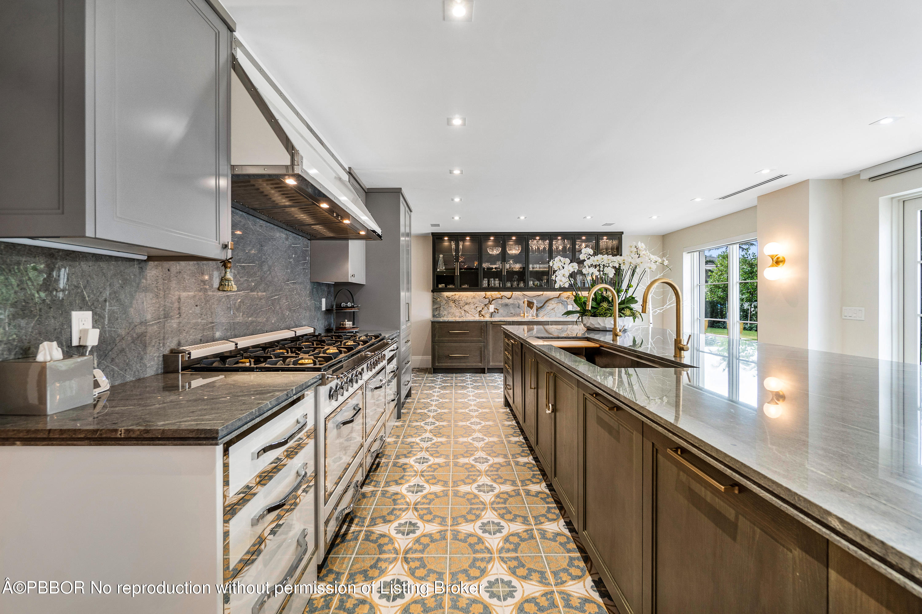 145 Kings Road Palm Beach, FL 33480 - Photo 11 of 25 a kitchen with stainless steel appliances granite countertop a stove a sink and a refrigerator