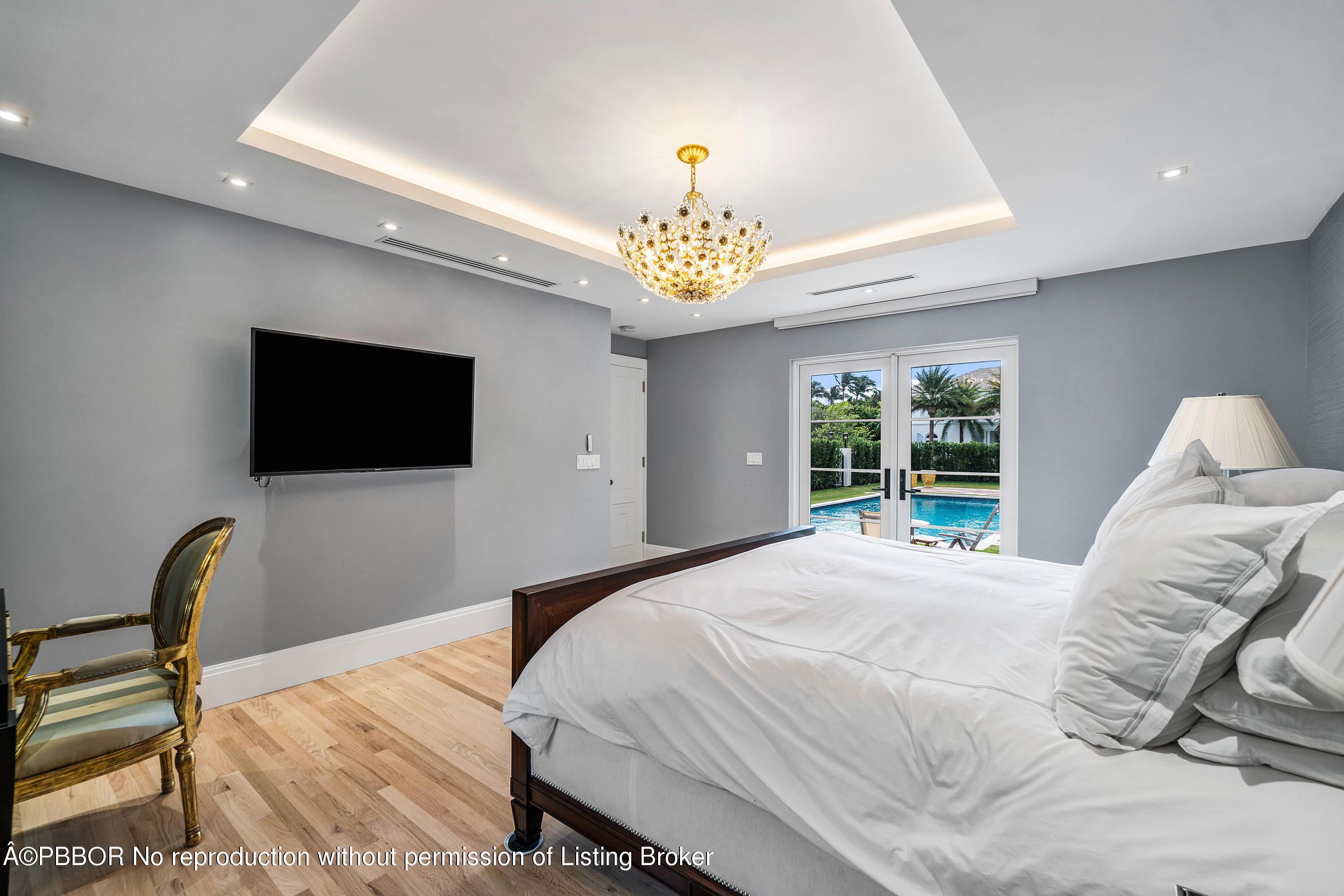 145 Kings Road Palm Beach, FL 33480 - Photo 13 of 25 a bedroom with a bed and a flat screen tv