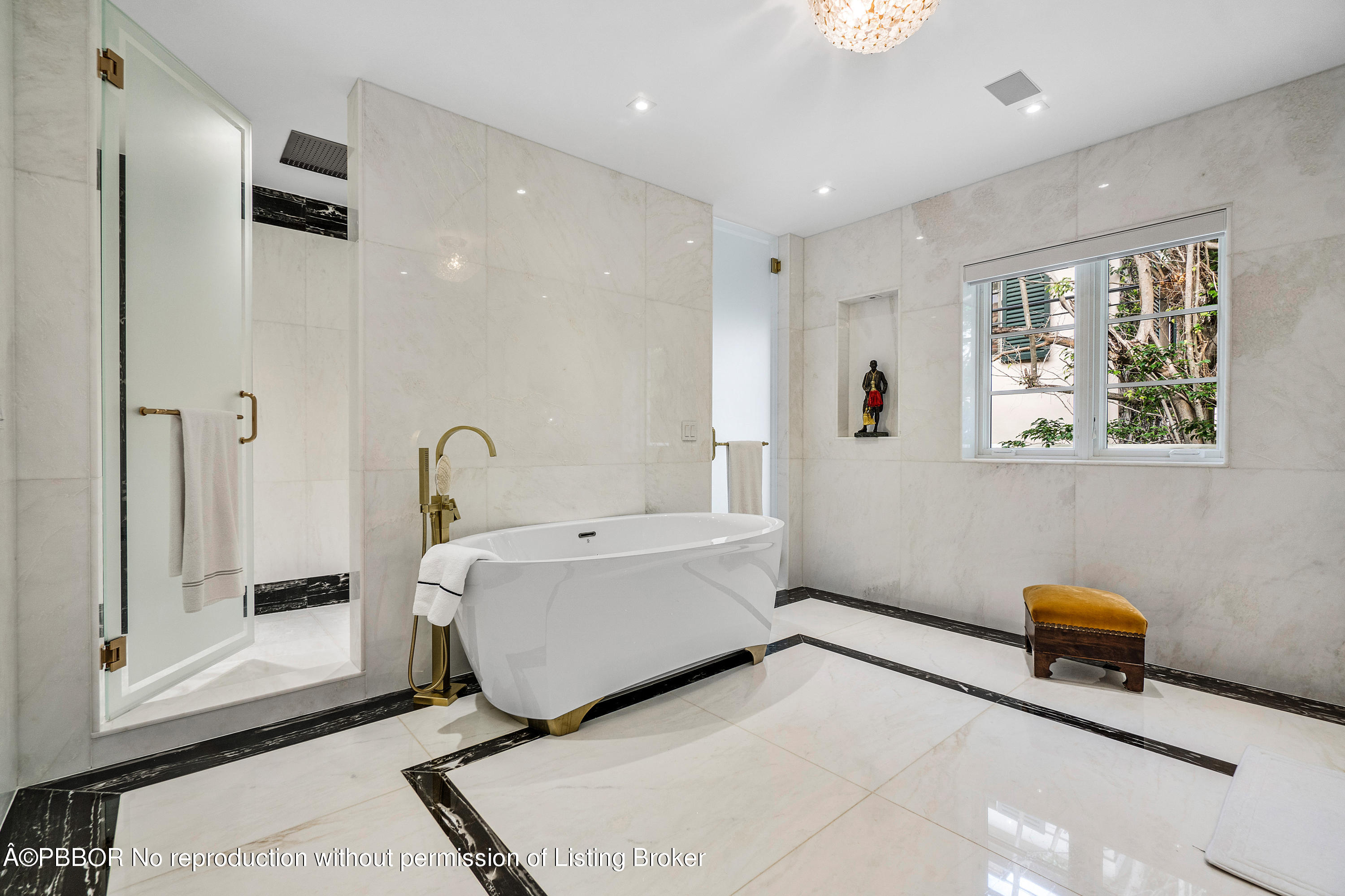 145 Kings Road Palm Beach, FL 33480 - Photo 14 of 25 a spacious bathroom with a tub sink and mirror