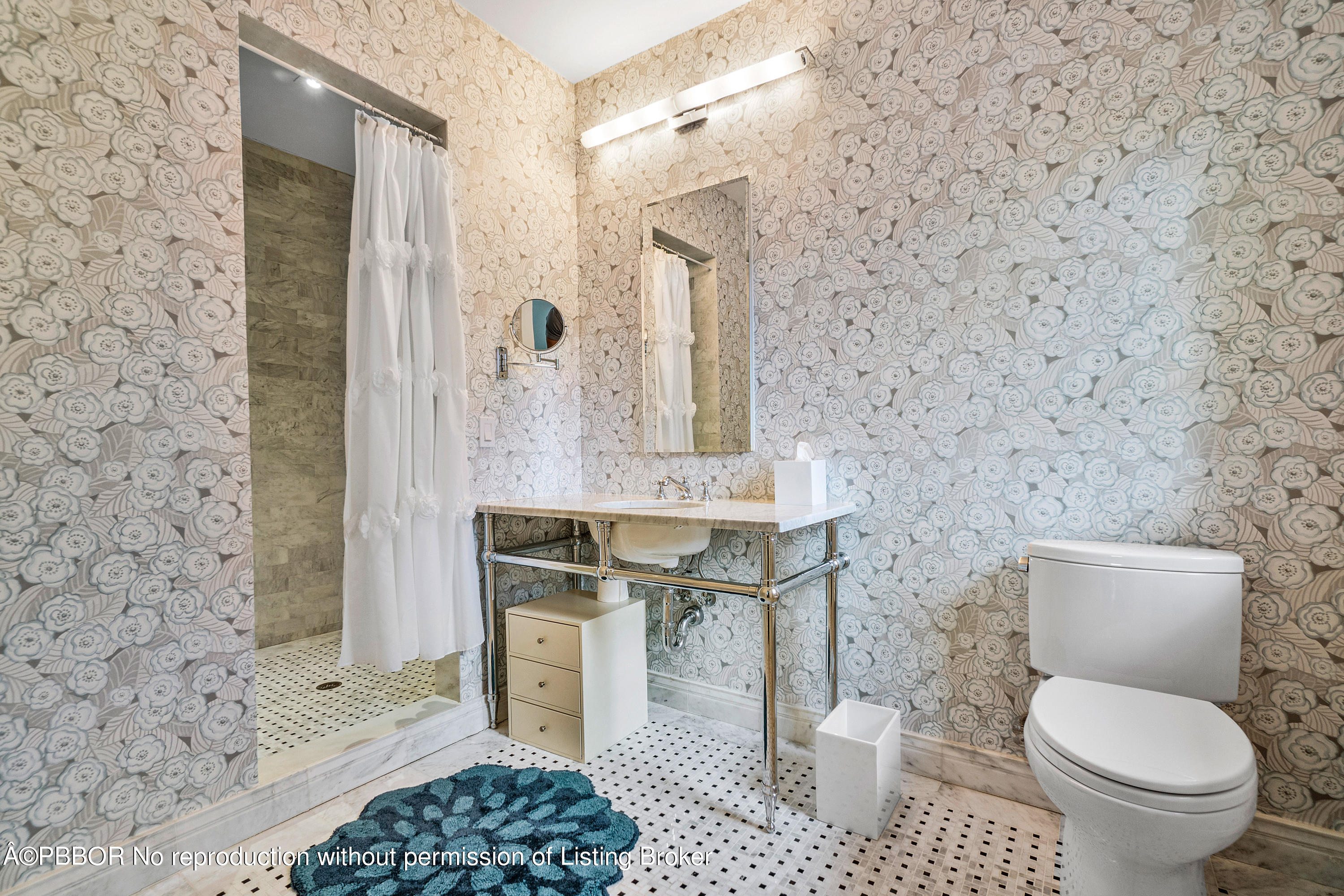 145 Kings Road Palm Beach, FL 33480 - Photo 18 of 25 a bathroom with a toilet a sink and a mirror