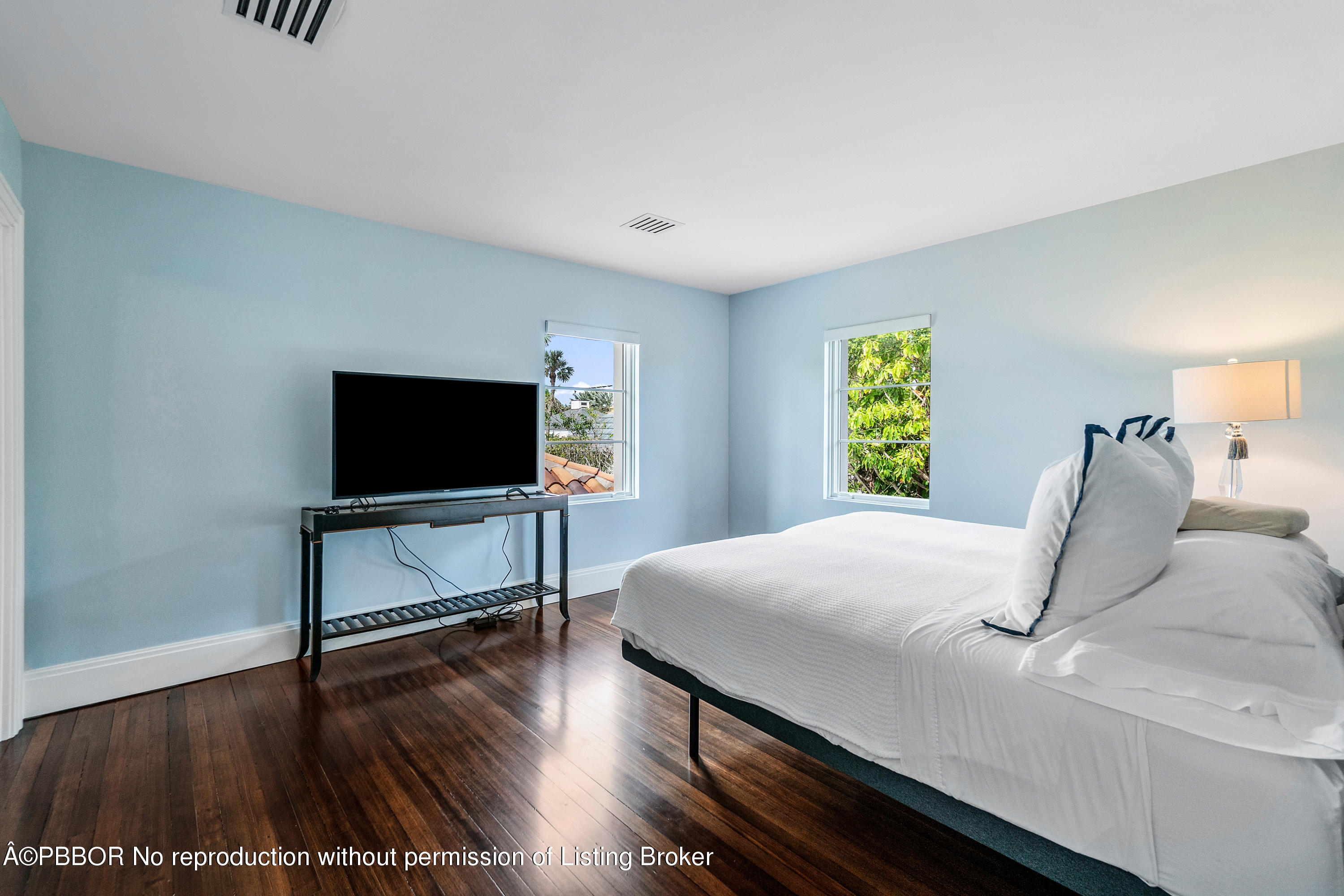 145 Kings Road Palm Beach, FL 33480 - Photo 21 of 25 a bedroom with a bed and a flat screen tv