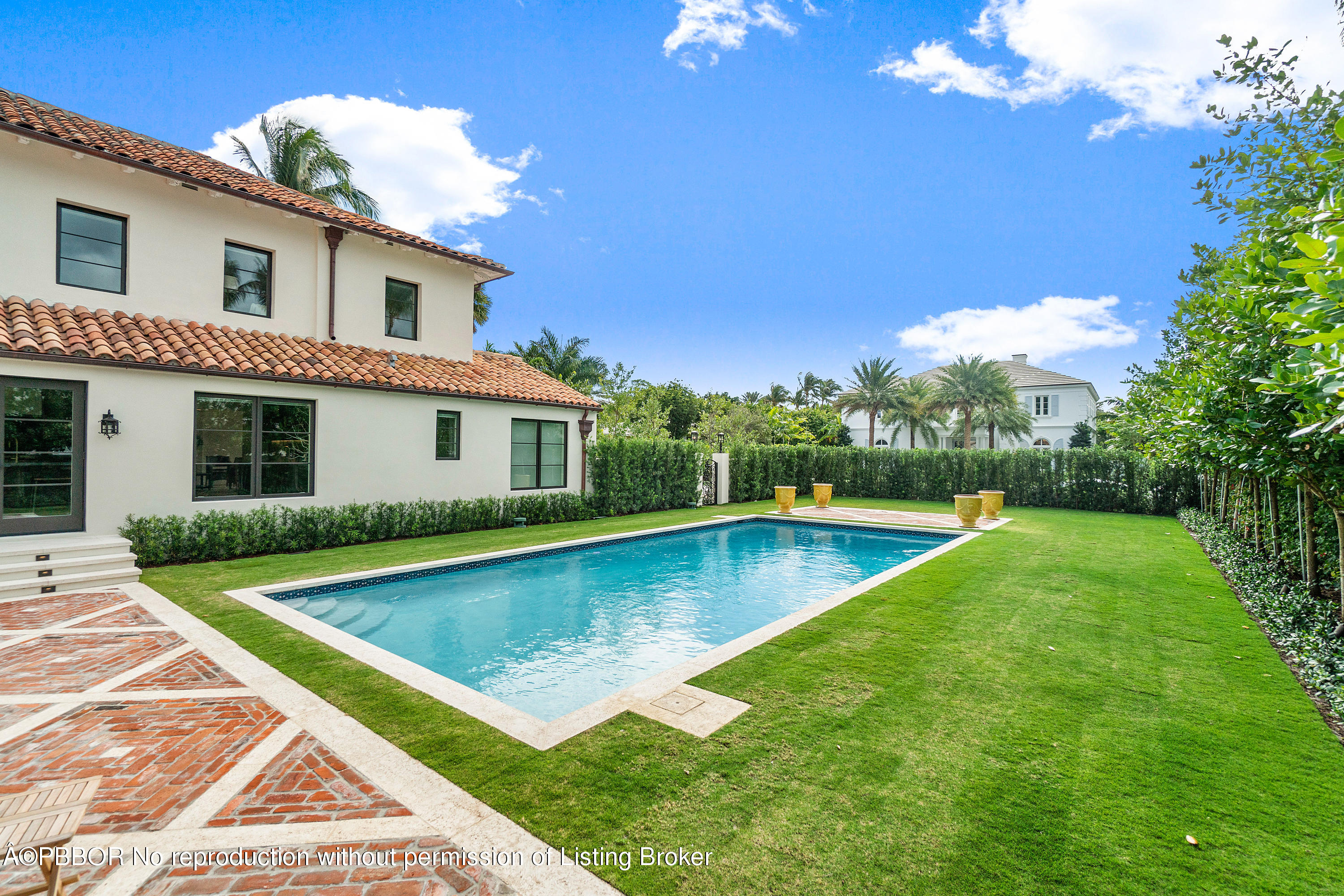 145 Kings Road Palm Beach, FL 33480 - Photo 24 of 25 a view of a house with swimming pool and a yard
