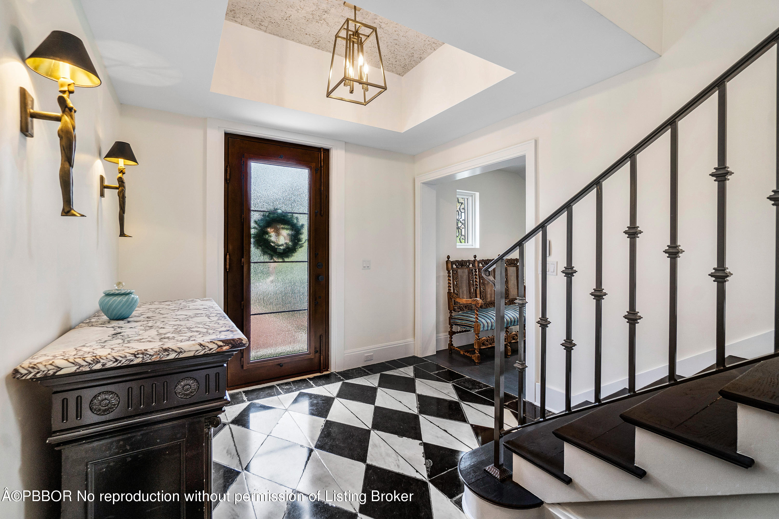 145 Kings Road Palm Beach, FL 33480 - Photo 4 of 25 a bedroom with a bed and wooden floor