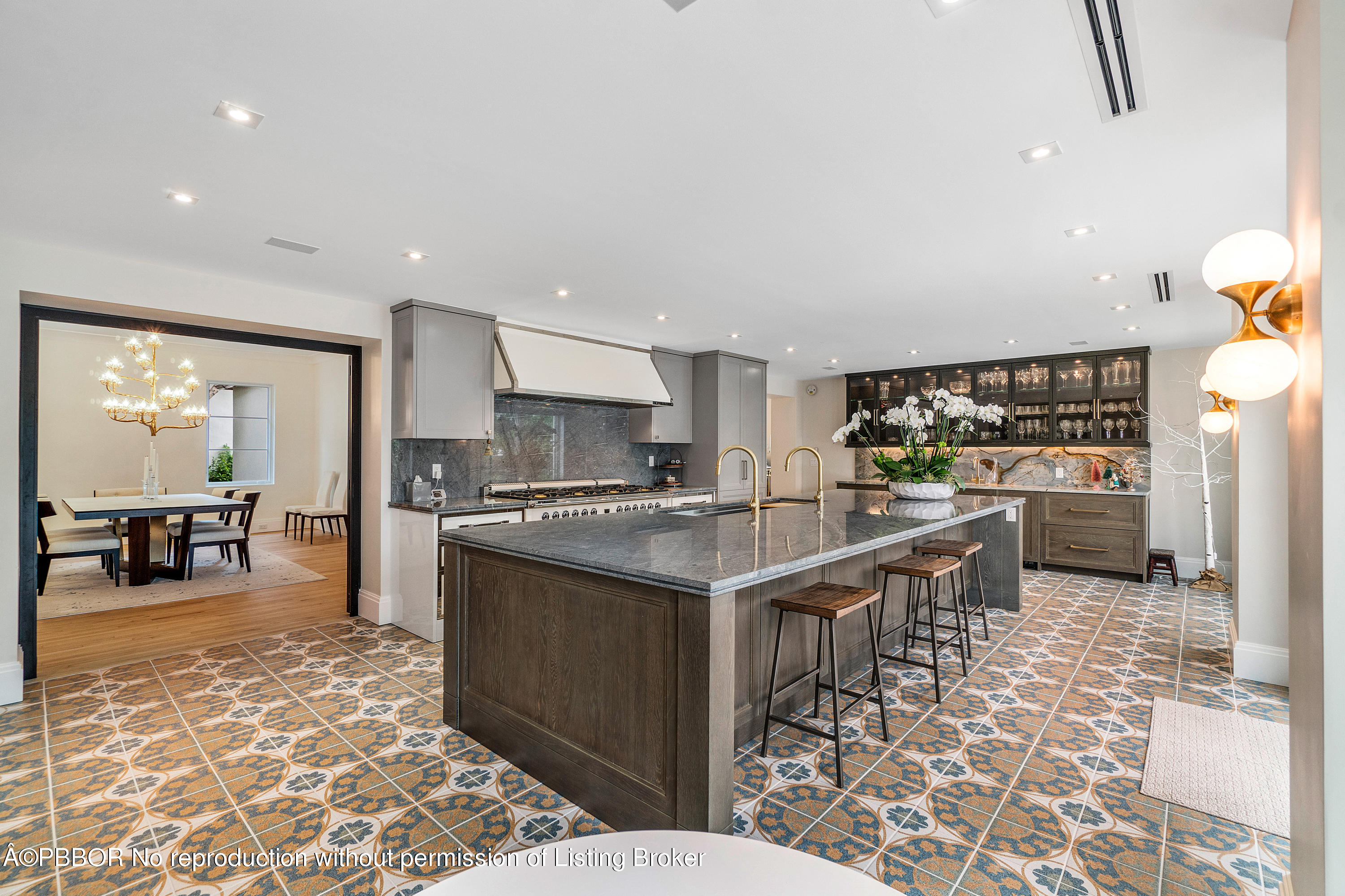 145 Kings Road Palm Beach, FL 33480 - Photo 9 of 25 a kitchen with stainless steel appliances kitchen island granite countertop a sink and cabinets