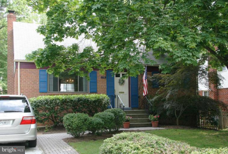 10009 Renfrew Road Silver Spring, MD 20901 - Photo 1 of 13 a front view of a house with a yard