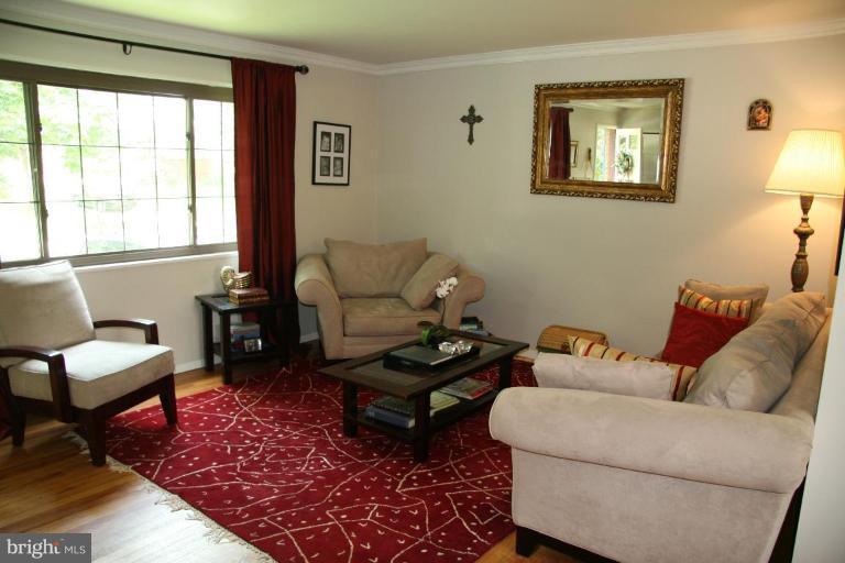 10009 Renfrew Road Silver Spring, MD 20901 - Photo 2 of 13 a living room with furniture and a window