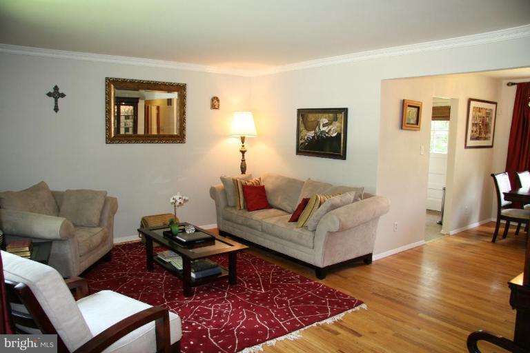 10009 Renfrew Road Silver Spring, MD 20901 - Photo 3 of 13 a living room with furniture and a rug