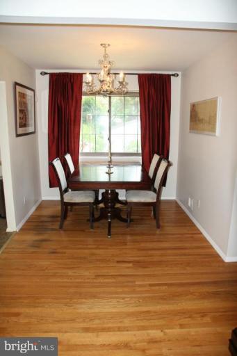 10009 Renfrew Road Silver Spring, MD 20901 - Photo 4 of 13 a view of a dining room with furniture window and wooden floor