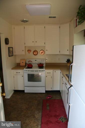 10009 Renfrew Road Silver Spring, MD 20901 - Photo 6 of 13 a view of a kitchen with sink washer and dryer