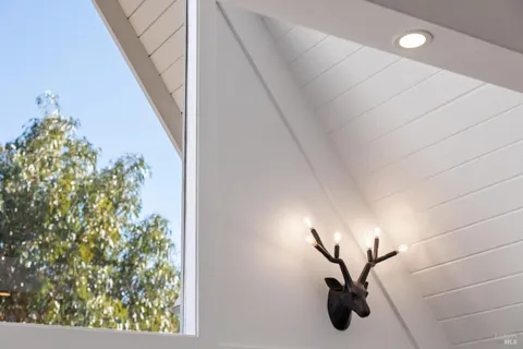 a view of a living room and with a mirror