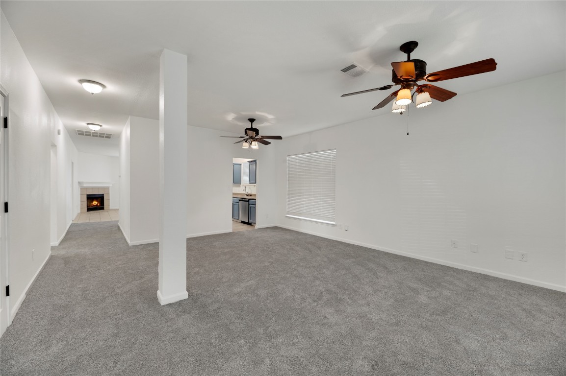 136 Shenandoah Trail Elgin, TX 78621 - Photo 12 of 27 an empty room with fan and windows