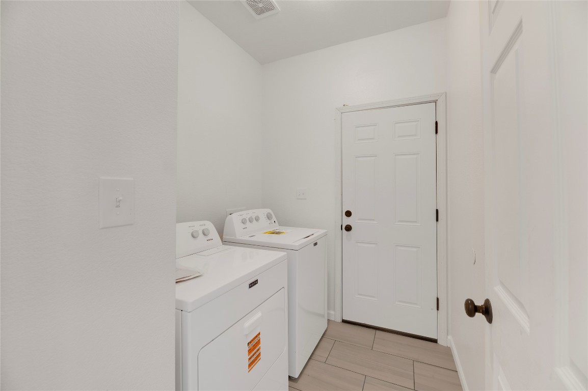 136 Shenandoah Trail Elgin, TX 78621 - Photo 13 of 27 a utility room with dryer and washer