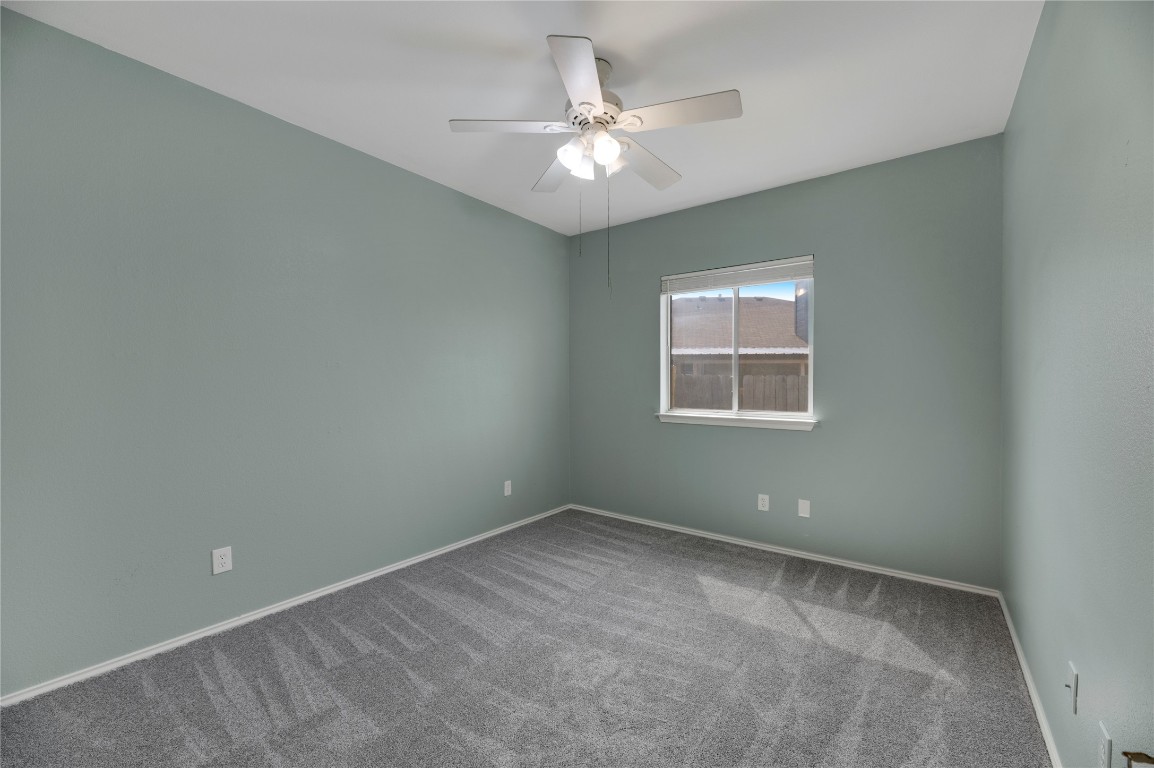 136 Shenandoah Trail Elgin, TX 78621 - Photo 17 of 27 an empty room with a window and a fan