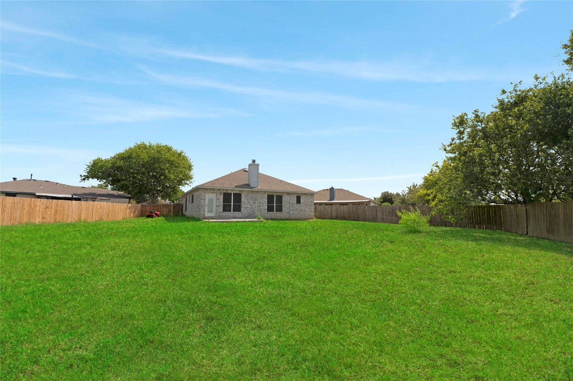136 Shenandoah Trail Elgin, TX 78621 - Photo 24 of 27 a front view of a house with garden