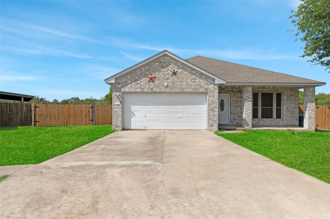 136 Shenandoah Trail Elgin, TX 78621 - Photo 27 of 27 a front view of a house with garden