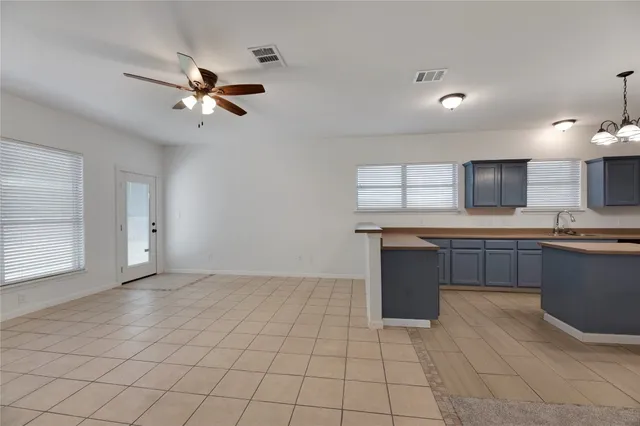 a view of a kitchen with a sink and a window