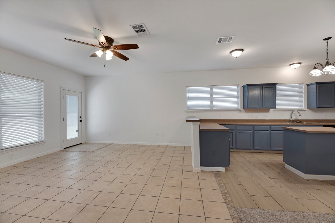 136 Shenandoah Trail Elgin, TX 78621 - Photo 8 of 27 a view of a kitchen with a sink and a window