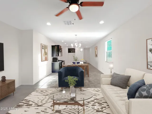 a view of a kitchen with a sink and a chandelier fan