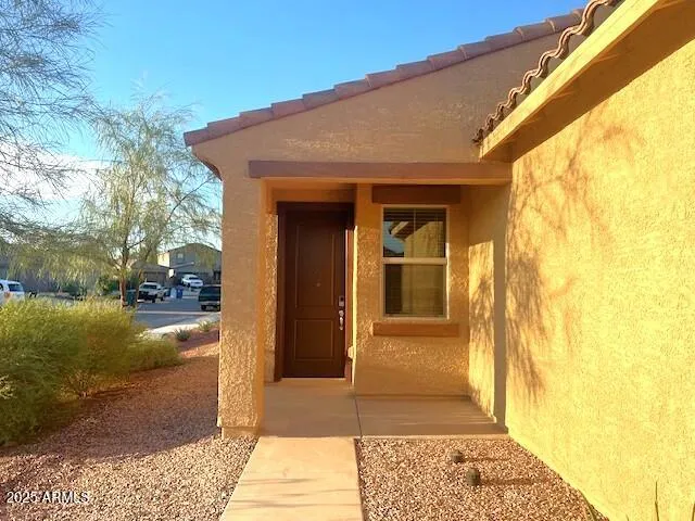 a kitchen with kitchen island a sink and a stove top oven with wooden floor
