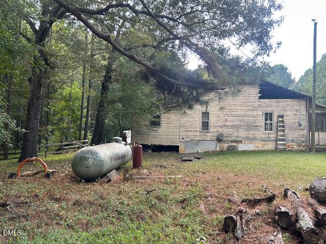 2510 Tody Goodwin Road Apex, NC 27502 - Photo 12 of 23 a view of a backyard with plants and large tree