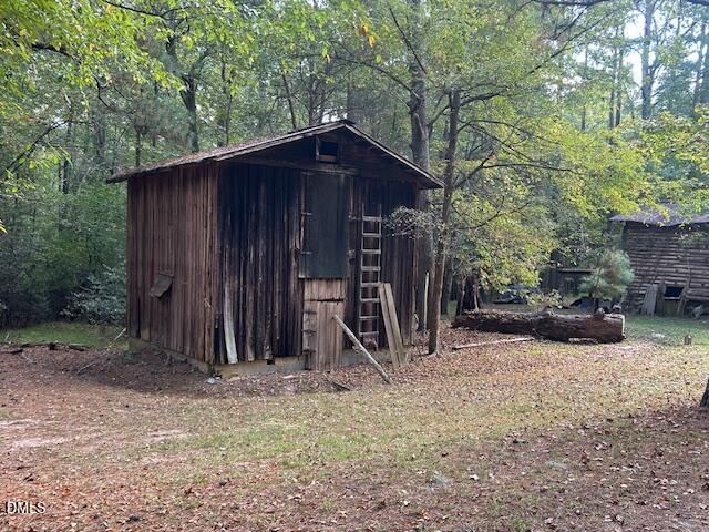 2510 Tody Goodwin Road Apex, NC 27502 - Photo 26 of 30 a view of a wooden house with large trees