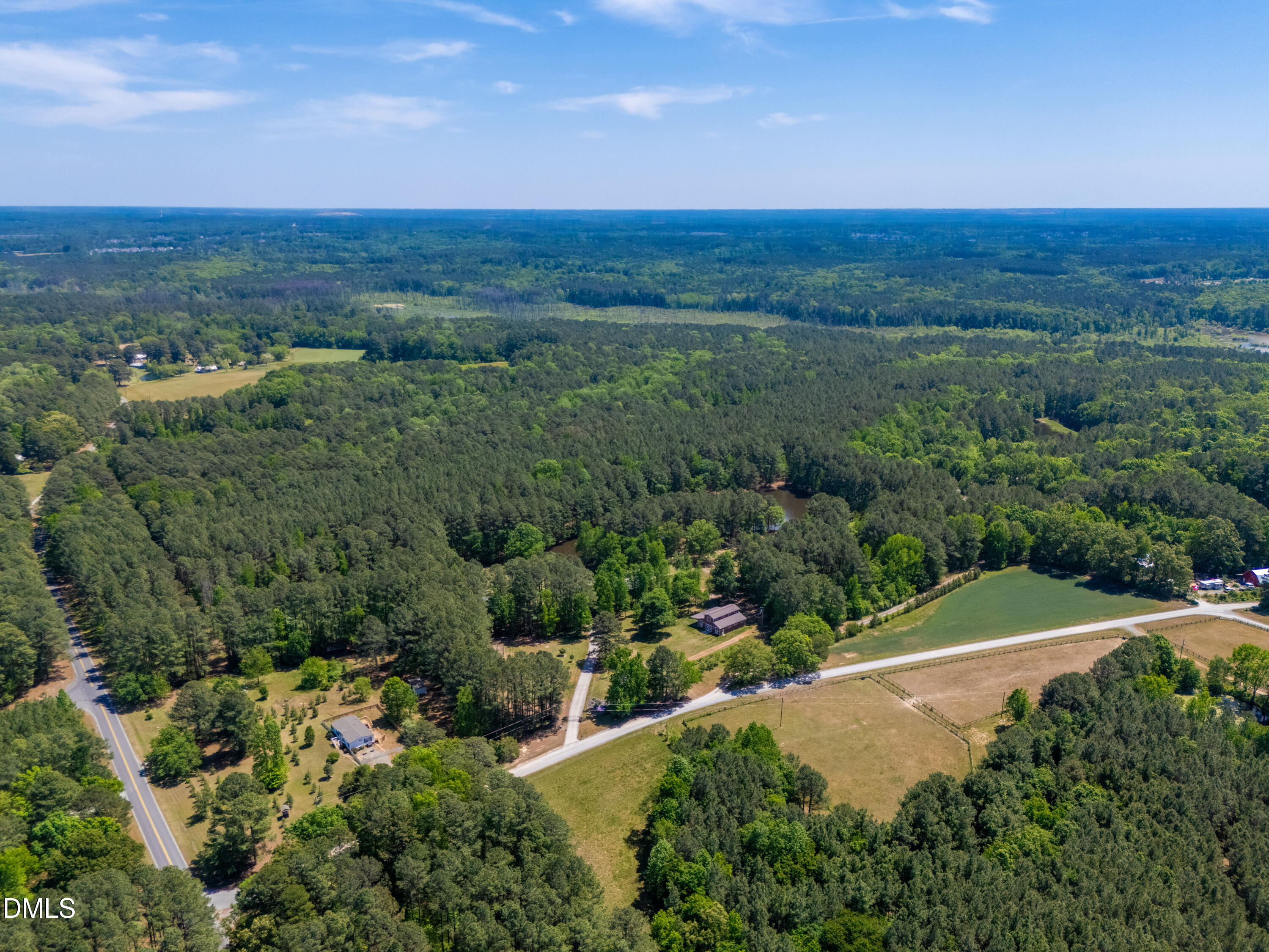 2510 Tody Goodwin Road Apex, NC 27502 - Photo 9 of 30 a view of a lush green hillside and an ocean view