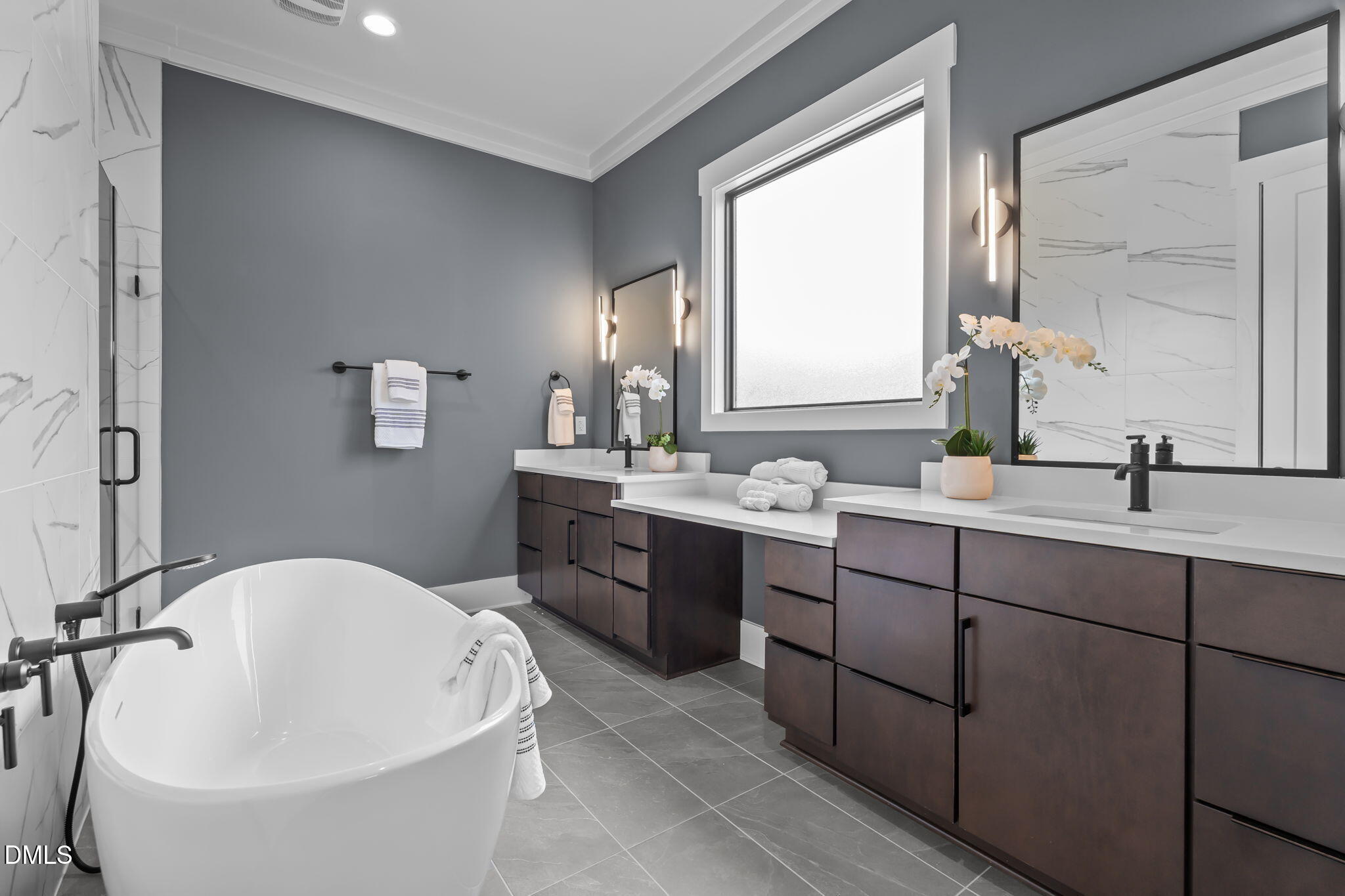 200 Broadleaf Lane Louisburg, NC 27549 - Photo 16 of 57 a bathroom with a bathtub sink and mirror