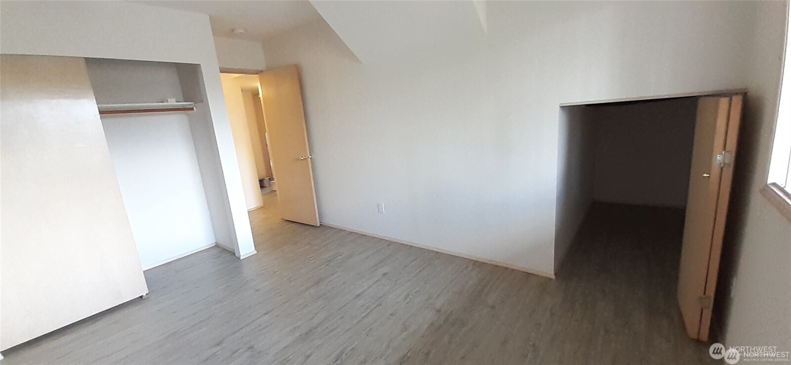 5501 Wilson Avenue South Seattle, WA 98118 - Photo 11 of 12 an empty room with wooden floor and closet