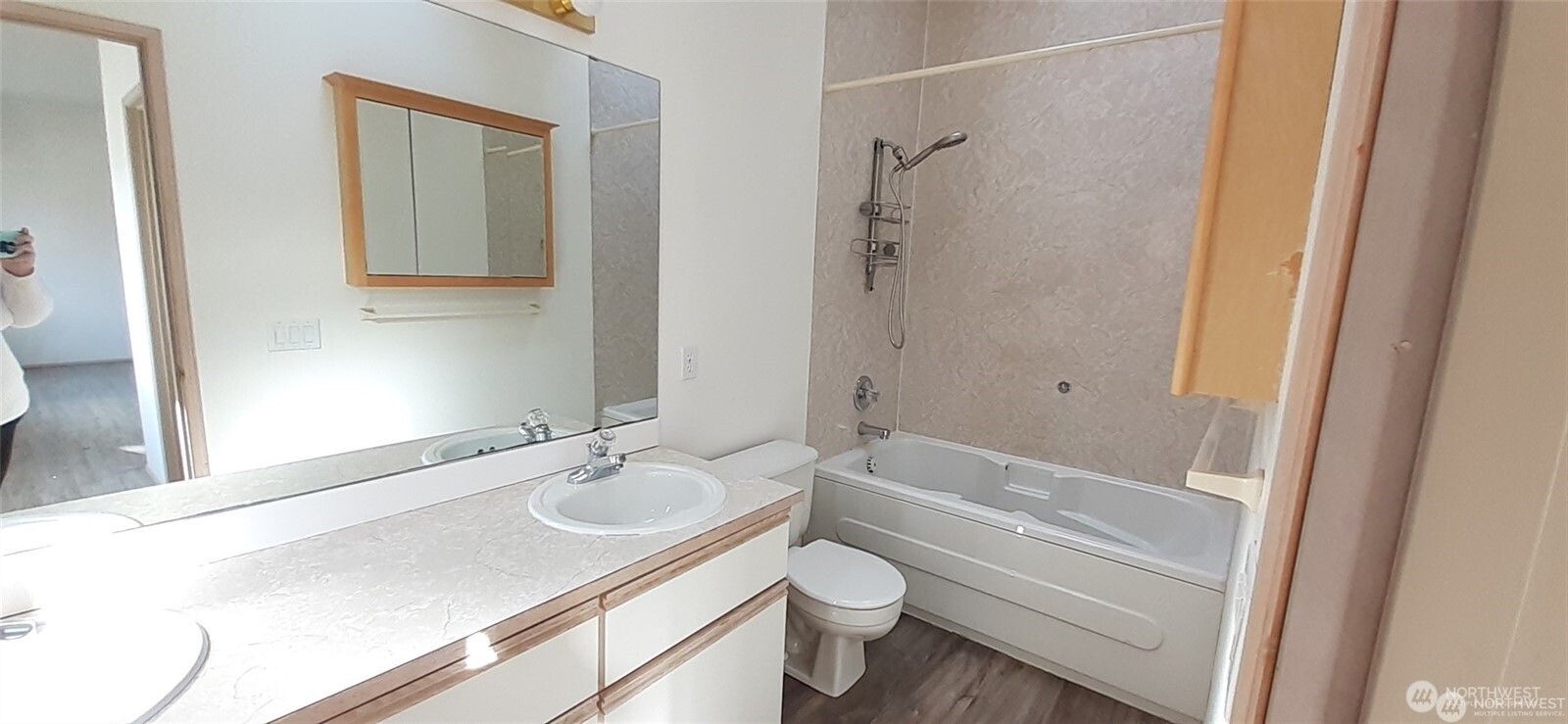 5501 Wilson Avenue South Seattle, WA 98118 - Photo 9 of 12 a bathroom with a granite countertop sink toilet and shower