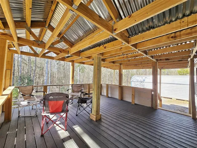 a view of a patio with table and chairs