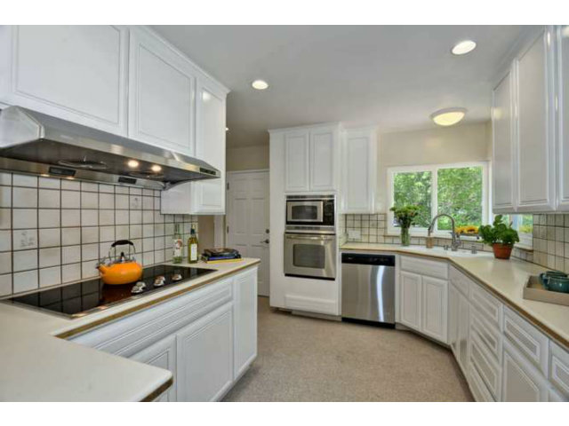 1030 Covington Road Los Altos, CA 94024 - Photo 4 of 14 a kitchen with a sink a stove and cabinets