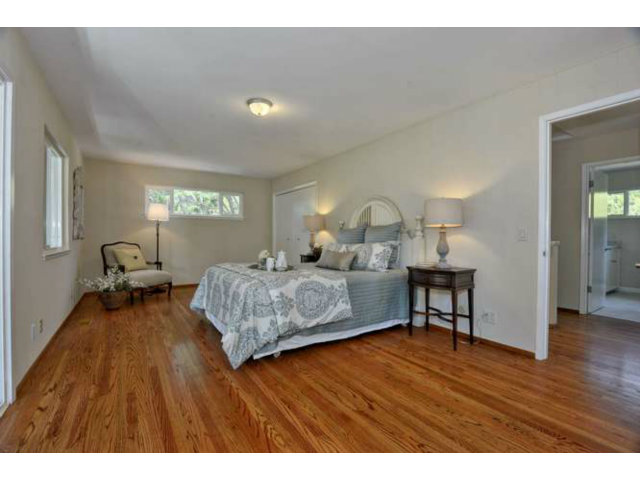 1030 Covington Road Los Altos, CA 94024 - Photo 10 of 14 a bedroom with a bed and wooden floor