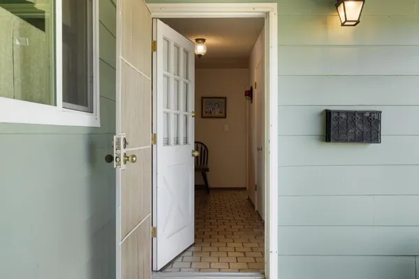 a view of a walk in closet and bathroom