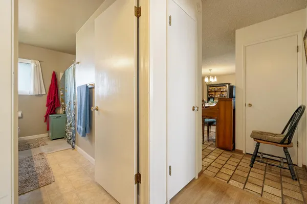 a view of a hallway with a furniture and a livingroom