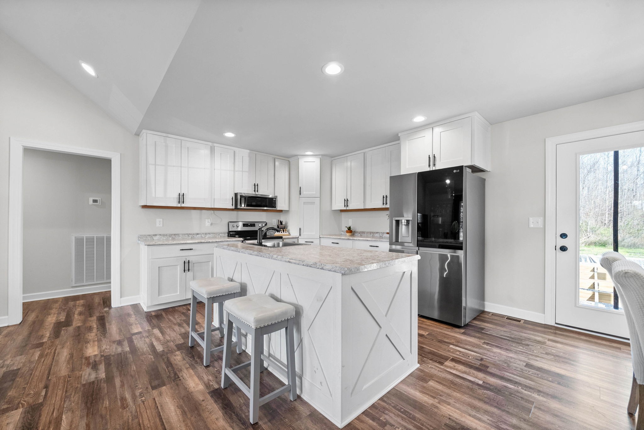 352 Scott Road Sharon Grove, KY 42280 - Photo 12 of 26 a kitchen with white cabinets and stainless steel appliances