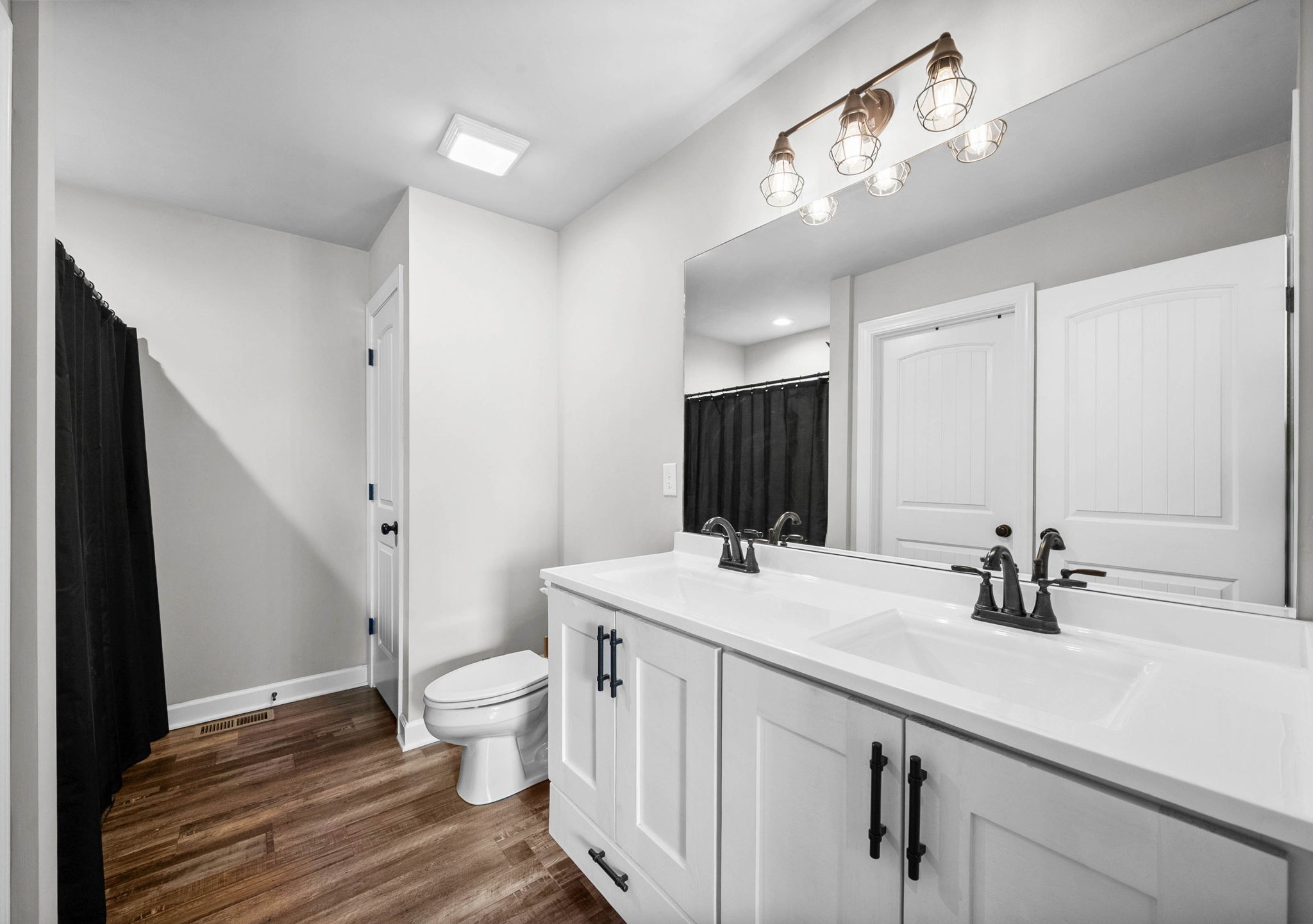 352 Scott Road Sharon Grove, KY 42280 - Photo 17 of 26 a bathroom with a sink a toilet a large mirror and shower