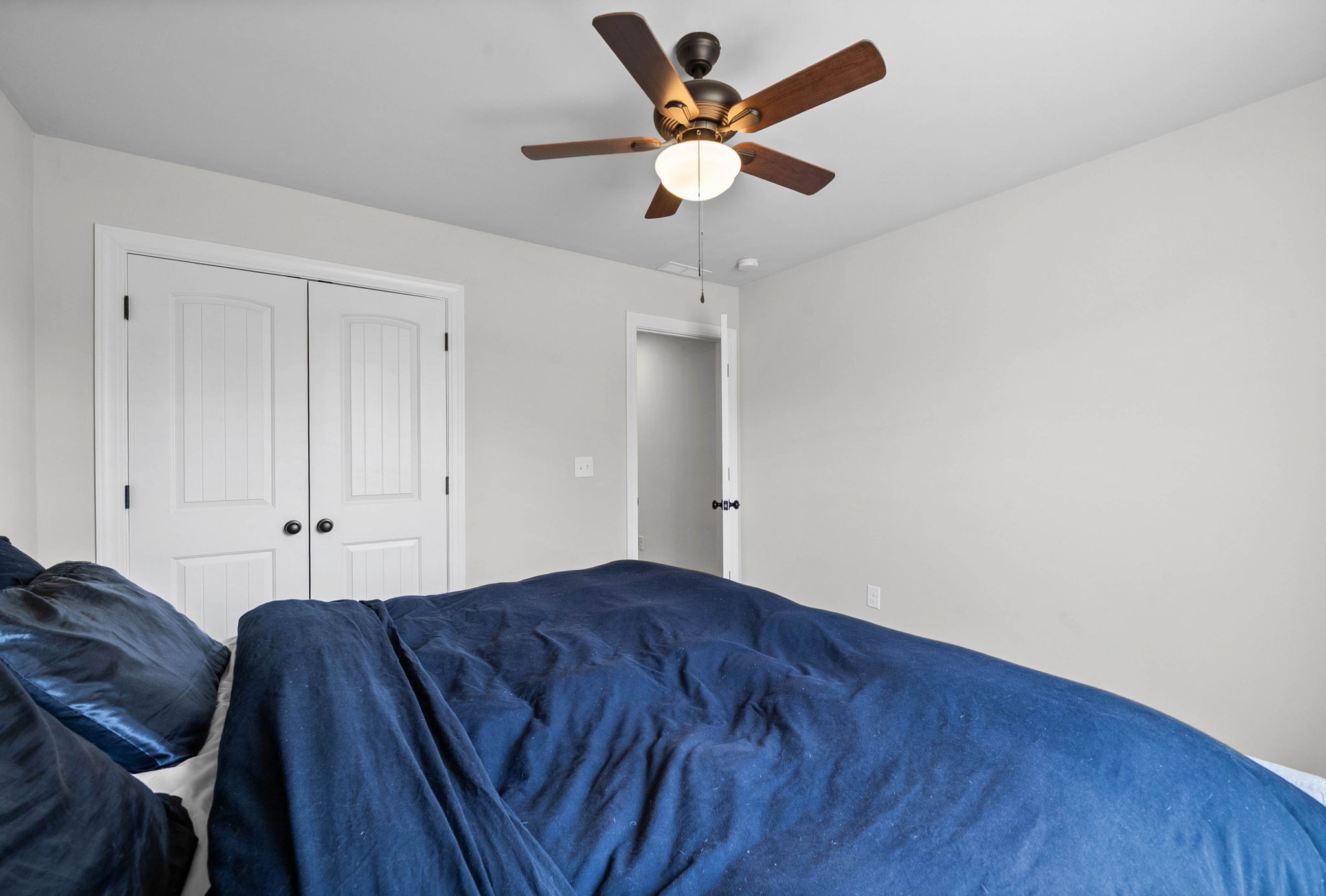 352 Scott Road Sharon Grove, KY 42280 - Photo 19 of 26 a bed room with a bed and a ceiling fan