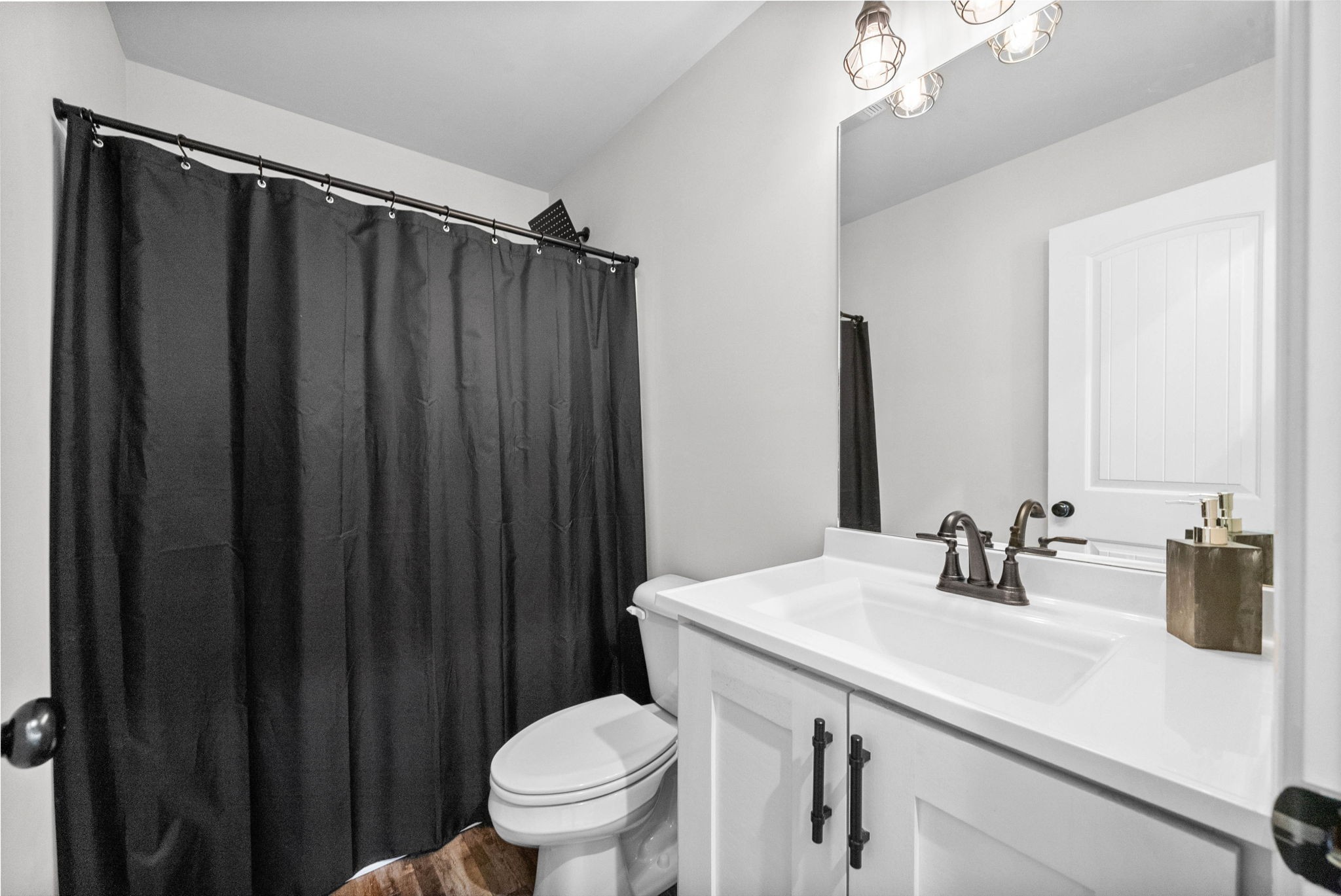 352 Scott Road Sharon Grove, KY 42280 - Photo 20 of 26 a bathroom with a sink a toilet a mirror and shower curtain