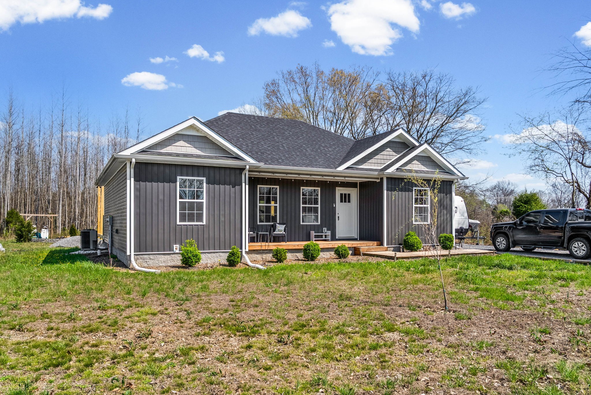 352 Scott Road Sharon Grove, KY 42280 - Photo 3 of 26 a front view of a house with garden