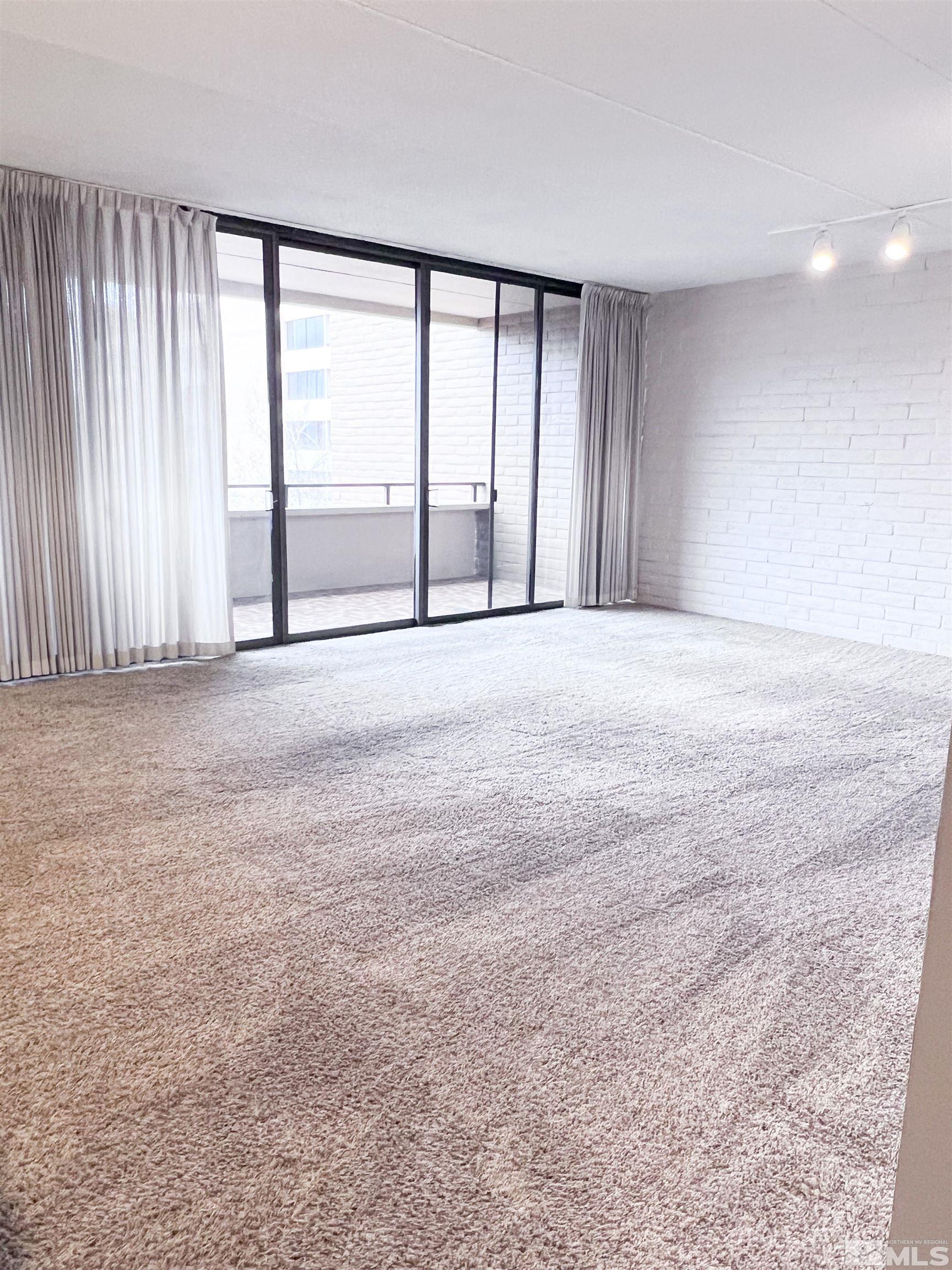 1200 Riverside Drive, Unit 1239 Reno, NV 89503 - Photo 31 of 35 a view of an empty room with a window