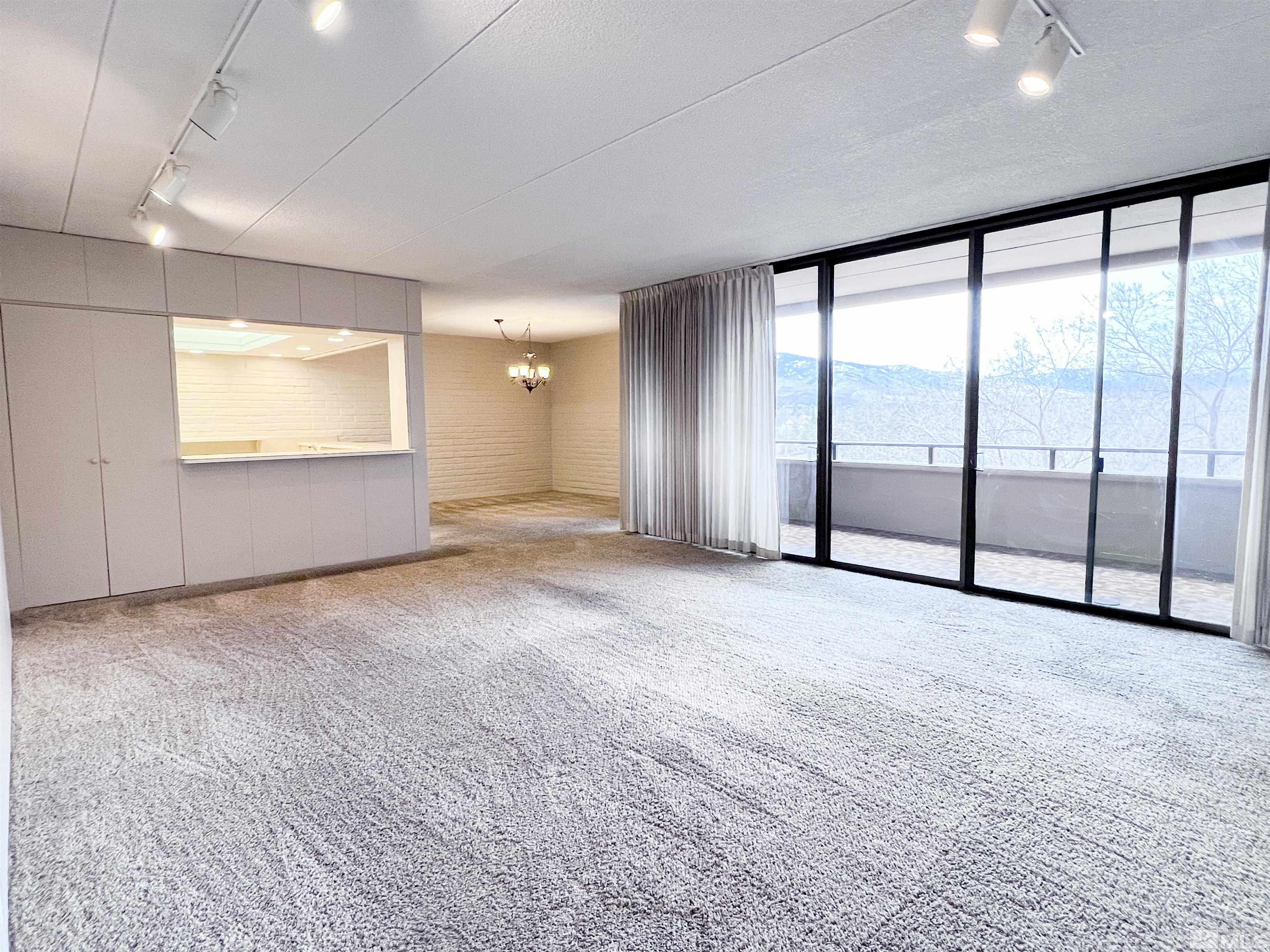 1200 Riverside Drive, Unit 1239 Reno, NV 89503 - Photo 7 of 35 an empty room with windows and view of room