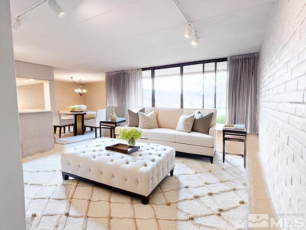 1200 Riverside Drive, Unit 1239 Reno, NV 89503 - Photo 8 of 35 a living room with furniture and a large window