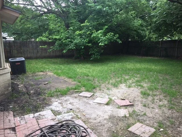 a view of a backyard with a garden